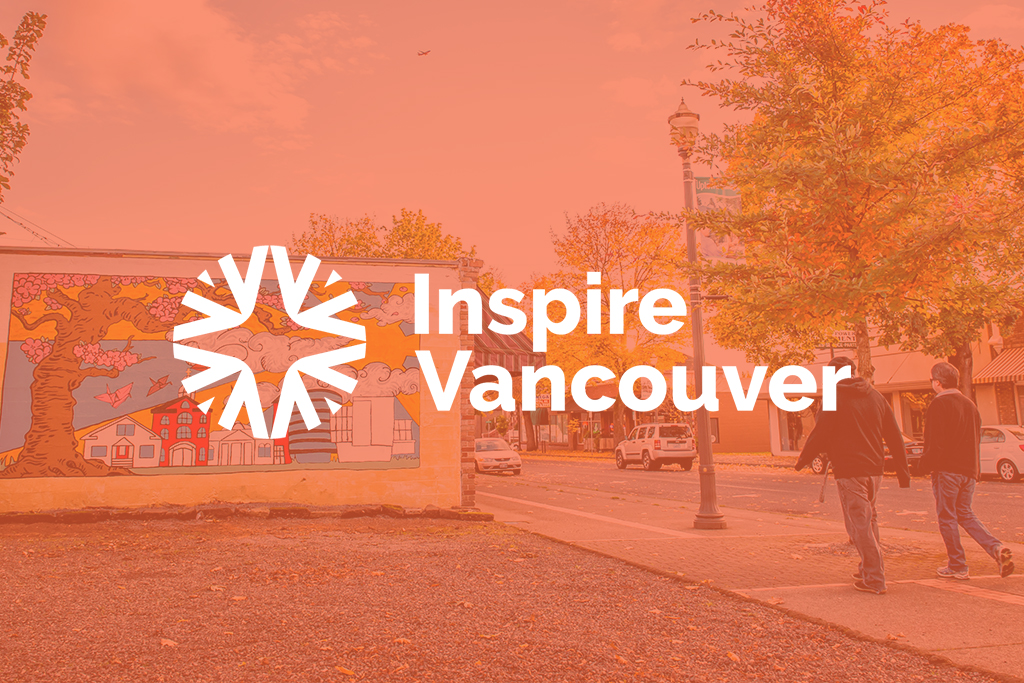 Mural of cherry blossoms on a building with an orange color overlay and the Inspire Vancouver logo